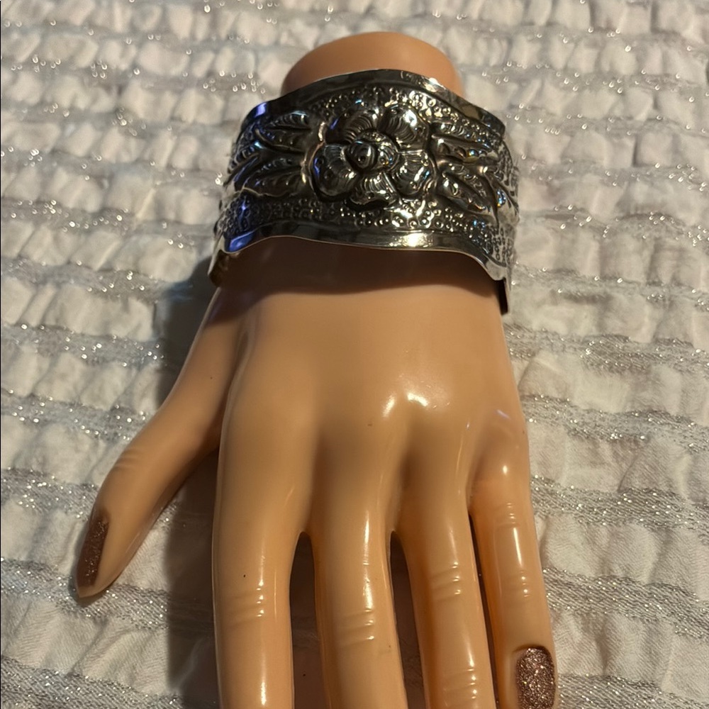 This Sterling Silver Floral Cuff Bracelet- this bracelet is over 100 yrs old